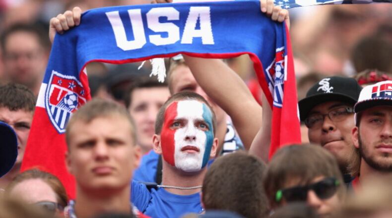 CHICAGO, IL - JUNE 26: Fans watch USA play Germany in a World Cup soccer match on one of two large screens placed for fans in Grant Park on June 26, 2014 in Chicago, Illinois. Organizers expected as many as 20,000 people to watch the game in the park. (Photo by Scott Olson/Getty Images) We'd whip 'em at what we call football every time. . (Photo by Scott Olson/Getty Images)