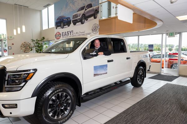 A Nissan Titan is displayed for sale at Bill Korum’s dealership in Pullayup, Washington. Amid a shortage of new cars, many buyers have been forced to kick the tires of overlooked models and brands. (Chona Kasinger/The New York Times)