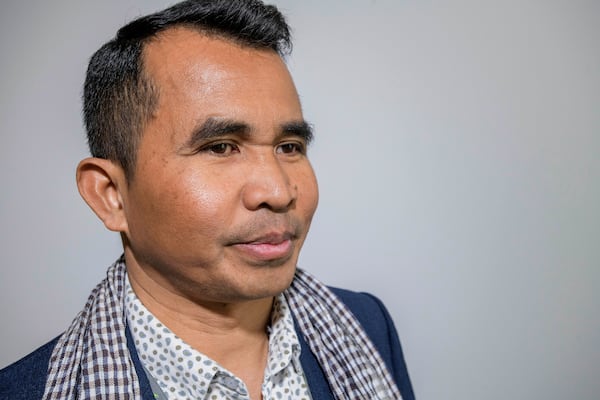 Hour Hum, a Cambodian reporter at Radio Free Asia who spent 7 years in a Thai refugee camp before arriving in the United States, poses for a portrait, Tuesday, April 1, 2025, at the RFA office in Washington. (AP Photo/Rod Lamkey, Jr.)