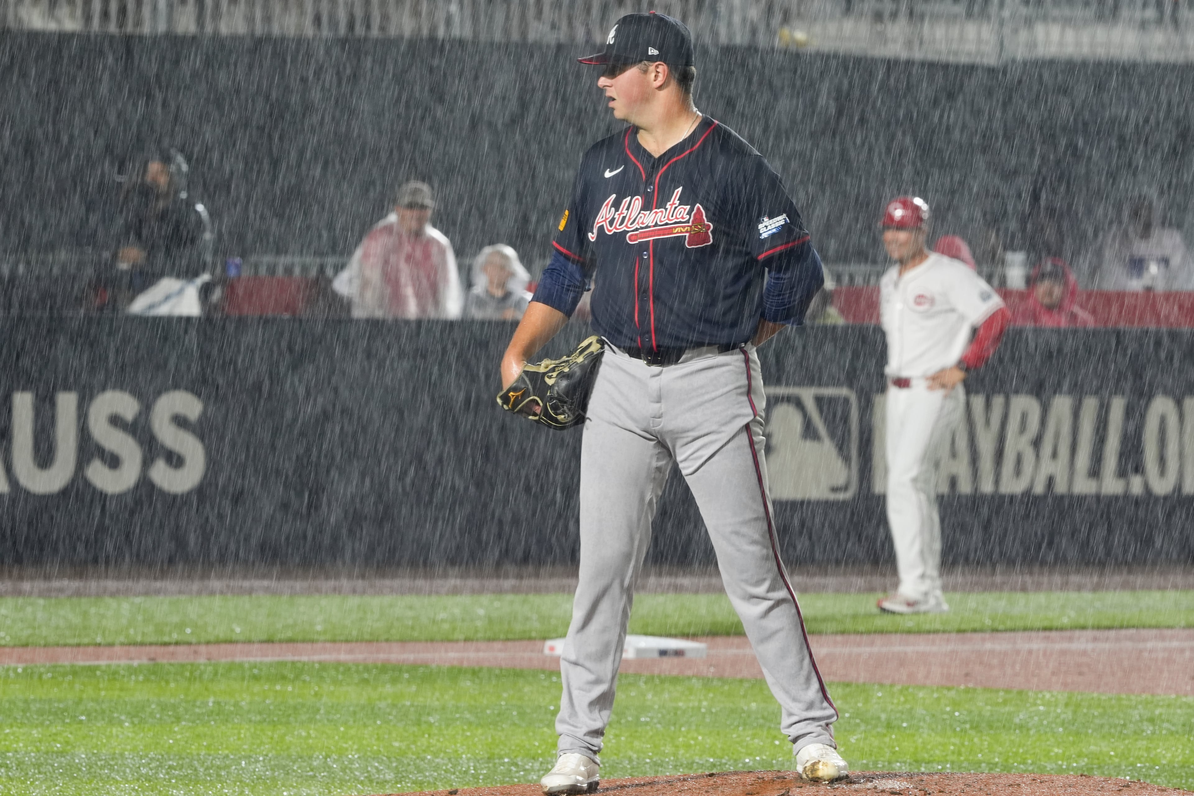 Atlanta Braves pitcher Austin Cox throws against the Cincinnati Reds during the first inning of the MLB Speedway Classic baseball game at Bristol Motor Speedway in Bristol, Tenn., Saturday, Aug. 2, 2025. (AP Photo/Chris Carlson)