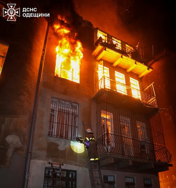 In this photo provided by the Ukrainian Emergency Service, firefighters put out the fire in an apartment building following Russia's massive air attack in Odesa, Ukraine, Friday, June 20, 2025. (Ukrainian Emergency Service via AP)