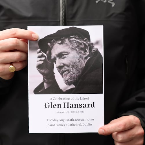 The Order of Service is held up ahead of the funeral of Glen Hansard at St Patrick's Cathedral in Dublin, Tuesday, Aug. 4, 2026. (Damien Eagers/PA via AP)