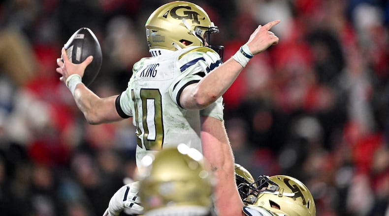 Georgia Tech quarterback Haynes King (10) celebrates after scoring a touchdown during the fourth quarter in an NCAA football game at Sanford Stadium, Friday, November 29, 2024, in Athens. Georgia won 44-42 in eight overtimes. (Hyosub Shin / AJC)