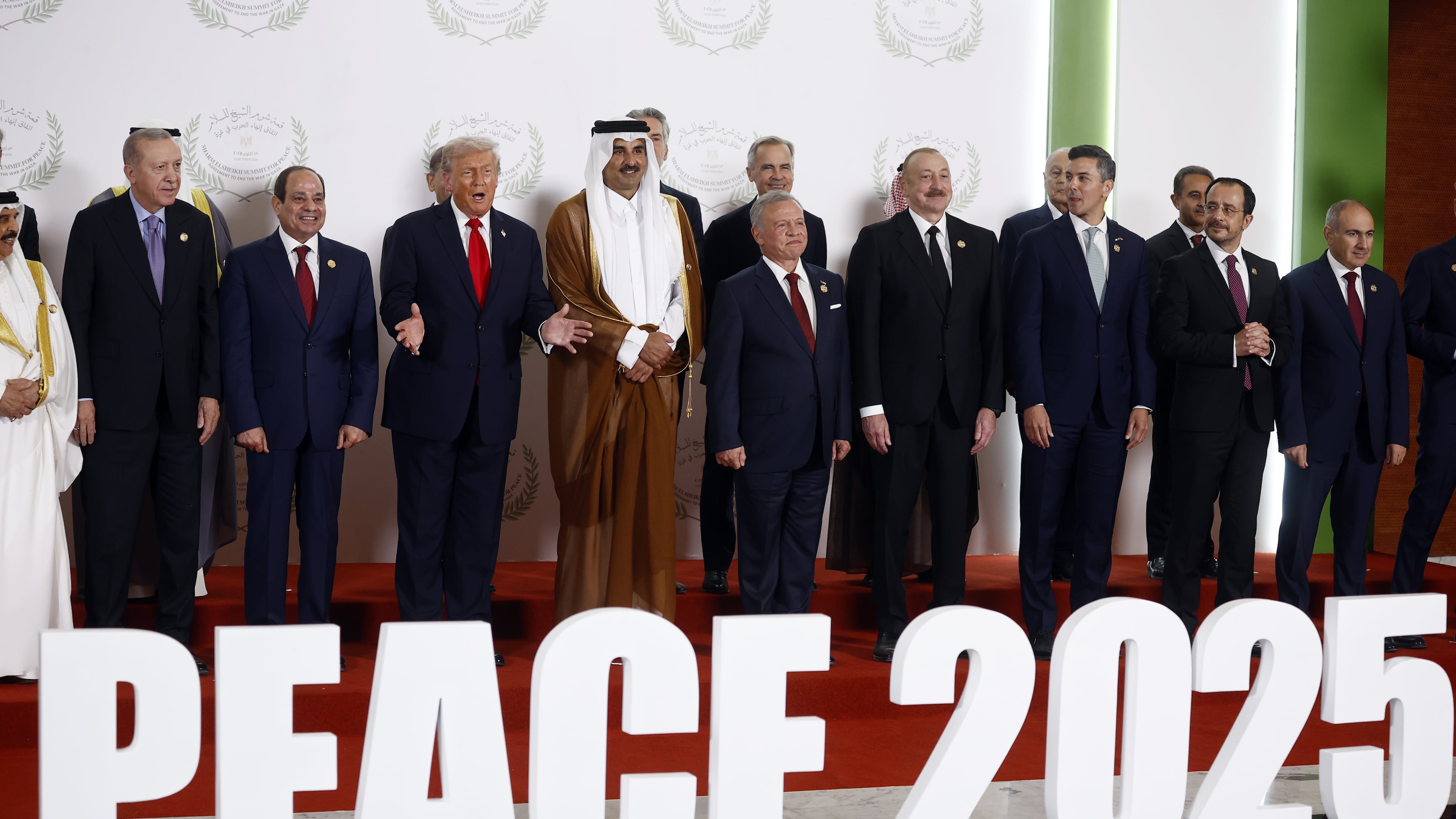 From the left, Turkish President Recep Tayyip Erdogan, Egyptian President Abdel Fattah al-Sisi, US President Donald Trump, Emir of Qatar Cheikh Tamim ben Hamad al-Thani, King Abdullah II of Jordan, and fellow dignitaries pose during the family picture at the Gaza International Peace Summit, in Sharm el-Sheikh, Egypt, Monday, Oct.13 2025. (Yoan Valat, Pool photo via AP)