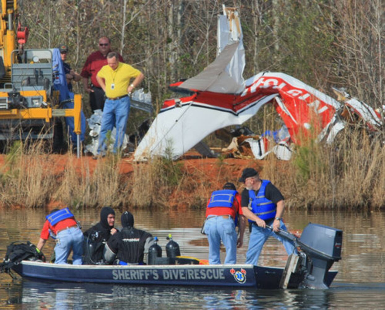Crews search Carrollton crash site