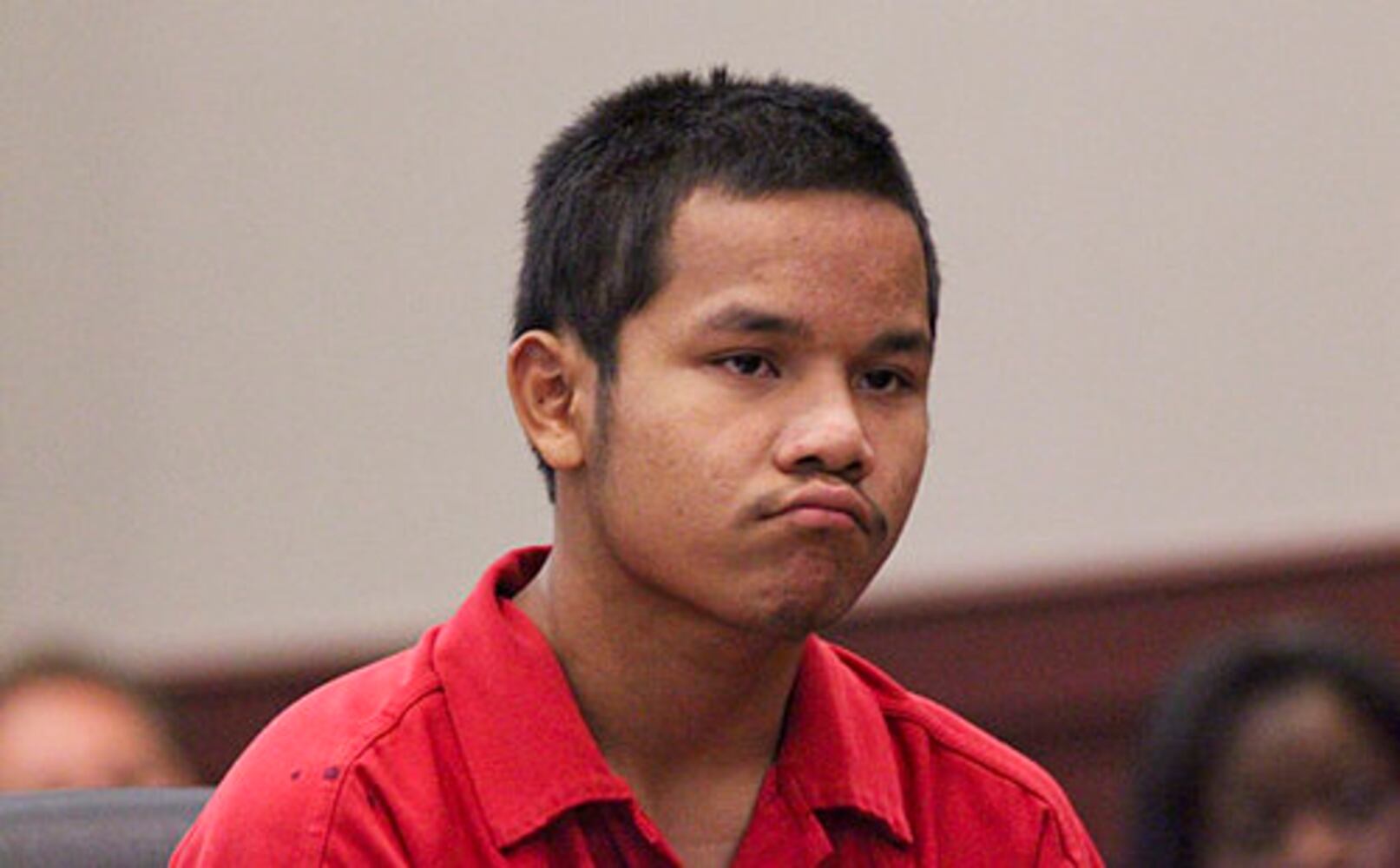Teen in court, accused of killing cop