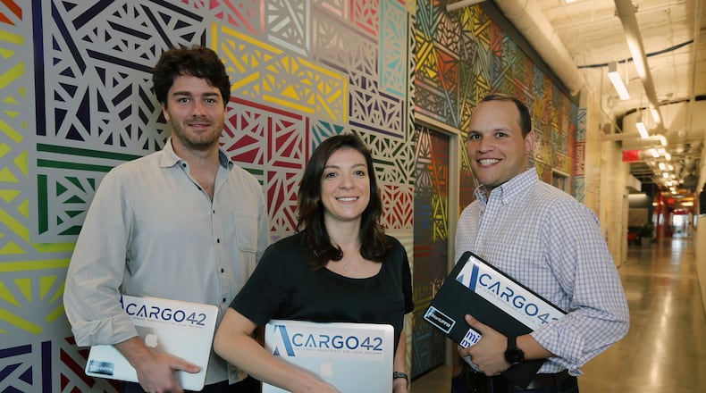 From left, Murilo Amaral, Francine Gervazio and Alfredo Keri, who together founded Cargo 42, at their company headquarters at 1951 NW Seventh Ave. in Miami, Fla. (Al Diaz/Miami Herald/TNS)