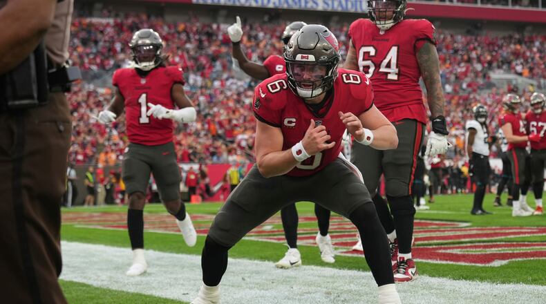 Tampa Bay Buccaneers quarterback Baker Mayfield (6) celebrates a touchdown I the first half during an NFL football game against the Jacksonville Jaguars, Sunday, Dec. 24, 2023, in Tampa, Fla. (AP Photo/Peter Joneleit)