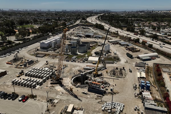 An aerial view shows the only entrance to an industrial tunnel in the Wilmington neighborhood of Los Angeles, Thursday, July 10, 2025, after a section of the tunnel partially collapsed Wednesday night. (AP Photo/Jae C. Hong)