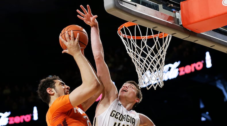 Georgia Tech's Ben Lammers, right, plays against Virginia Tech's Satchel Pierce in the first half of an NCAA college basketball game Saturday, Jan. 16, 2016, in Atlanta. (AP Photo/David Goldman)