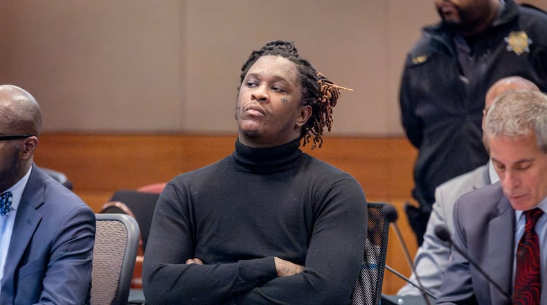 Young Thug, whose real name is Jeffery Williams, listens to Fulton County Chief Judge Ural Glanville as he tells the court his trial is on hold until next year after one of the defendants was stabbed over the weekend while in Jail. (Steve Schaefer/steve.schaefer@ajc.com)