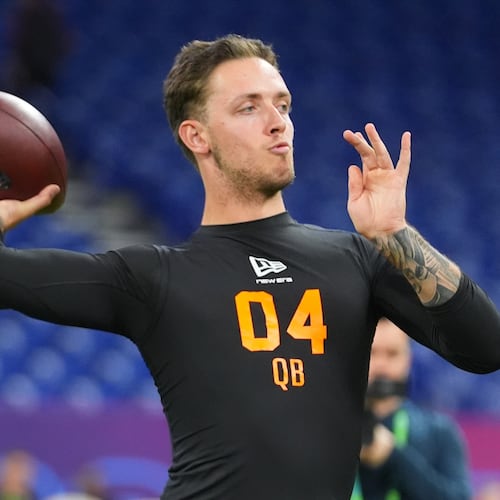 FILE - Miami quarterback Carson Beck (04) runs a drill at the NFL football scouting combine in Indianapolis, Feb. 28, 2026. (AP Photo/Julio Cortez, File)