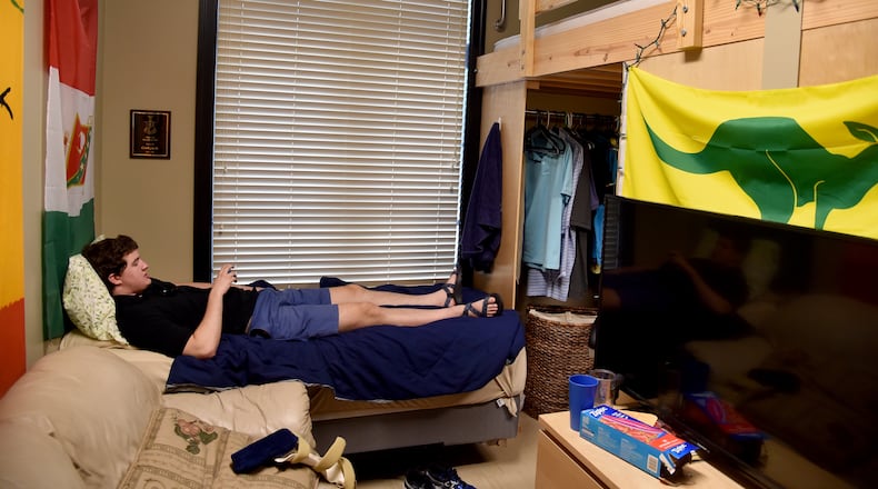 082516 Atlanta: Georgia Tech student Clark Jacobs hangs out in his room at the Kappa Sigma fraternity house Thursday August 25, 2016. Jacobs is back in school after cracking his skull in January 10, 2015 when he fell out of his bunk bed. The mechanical engineering student isn't taking any chances and now sleeps on a bed below his assigned loft.  Jacobs and his family have started a public awareness campaign to have guard rails installed on bunk and loft beds. They hope the practice becomes mandatory.   BRANT SANDERLIN/BSANDERLIN@AJC.COM
