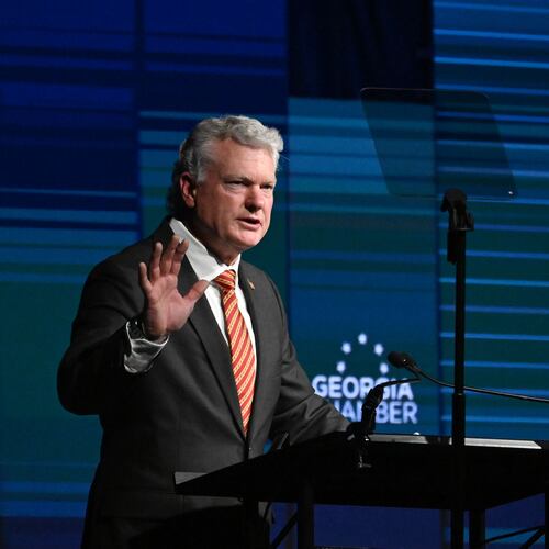 Republican U.S. Senate nominee Mike Collins speaks during the Georgia Chamber Congressional Luncheon at The Classic Center on Wednesday. Collins has sought to portray Democratic U.S. Sen. Jon Ossoff as a socialist, a charge Ossoff's camp dismissed as false. (Hyosub Shin/AJC)