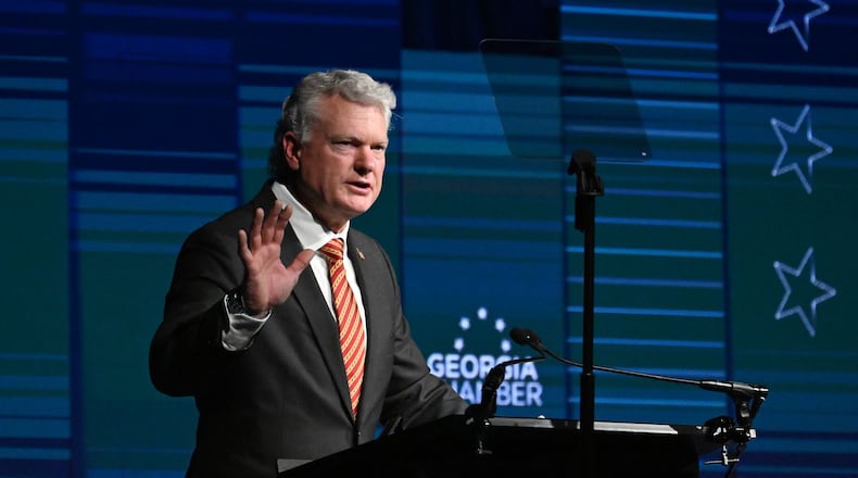 Republican U.S. Senate nominee Mike Collins speaks during the Georgia Chamber Congressional Luncheon at The Classic Center on Wednesday. Collins has sought to portray Democratic U.S. Sen. Jon Ossoff as a socialist, a charge Ossoff's camp dismissed as false. (Hyosub Shin/AJC)
