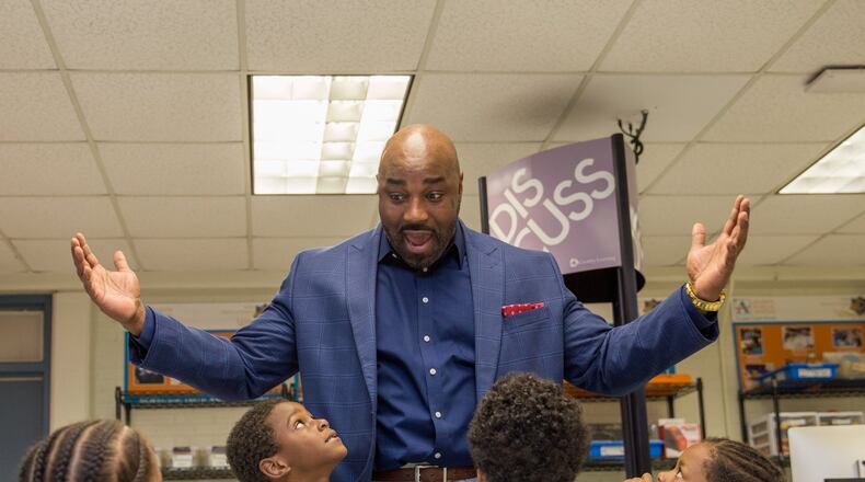 Edward Henderson III, a civic leader with Hands on Atlanta’s Discovery Program, catches up with kindergartners Taylor Gresham, left, Darrion Jackson, Princeton Donald and Tylar Walker. (Jenni Girtman / Atlanta Event Photography)
