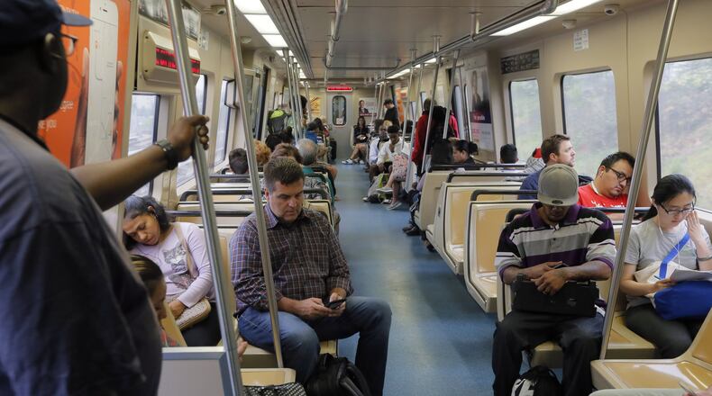 April 19, 2017 - Atlanta - MARTA passengers aboard the Gold line which is headed south from the Doraville station. MARTAs Twitter account reported the parking lots were full at 8:11 AM. The collapse of a portion of I-85 some three weeks ago has been a headache for Atlanta drivers, but is proving to be a golden opportunity for MARTA. Long neglected in a car-crazy region, MARTA is getting a second look from commuters desperate to avoid gridlock. Ridership is up. MARTA parking lots are packed. BOB ANDRES /BANDRES@AJC.COM