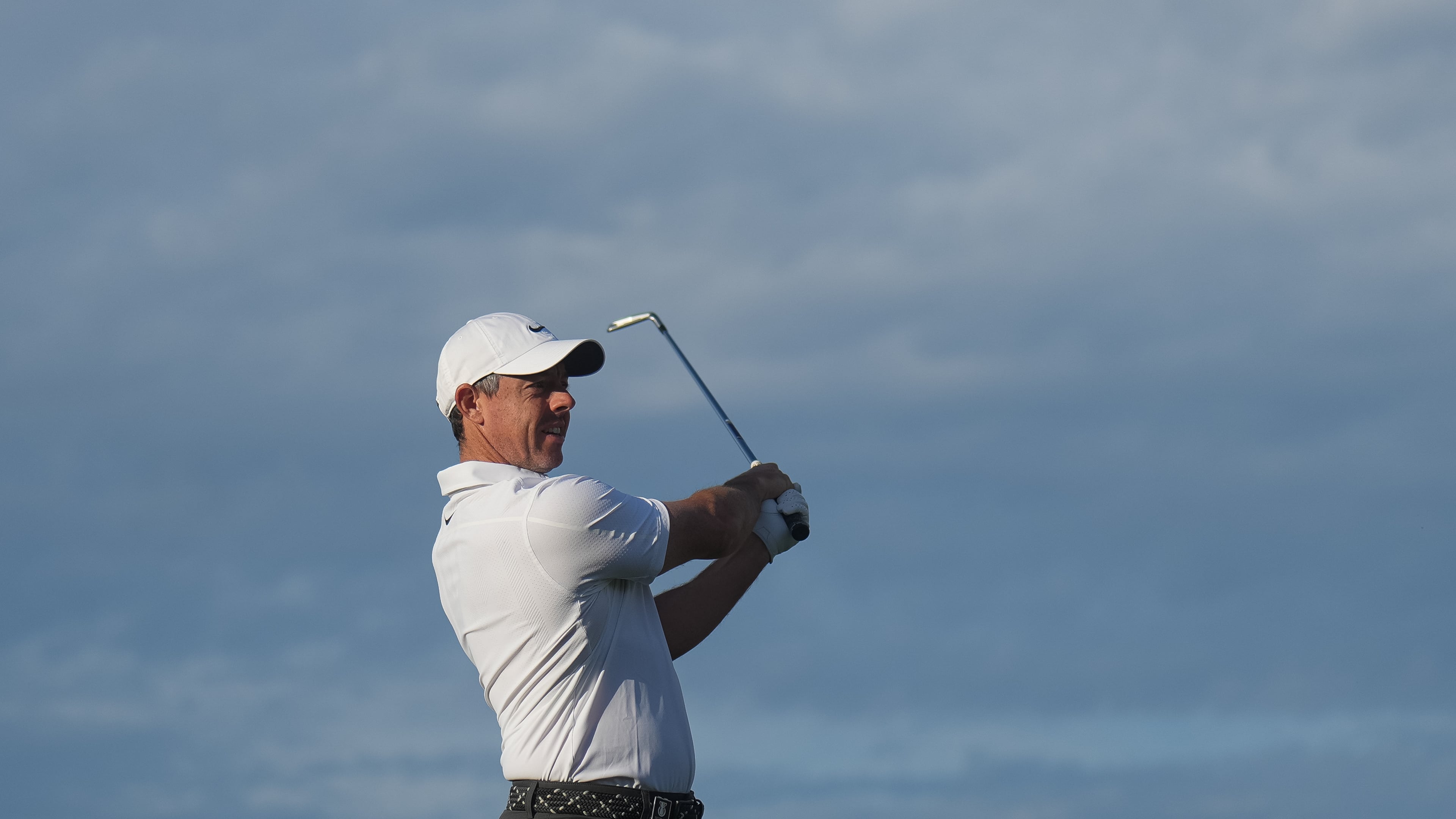 Rory McIlroy of Northern Ireland plays an approach shot on the 10th hole during the first round of the Australian Open golf tournament in Melbourne, Australia, Thursday, Dec. 4, 2025. (AP Photo/Asanka Brendon Ratnayake)