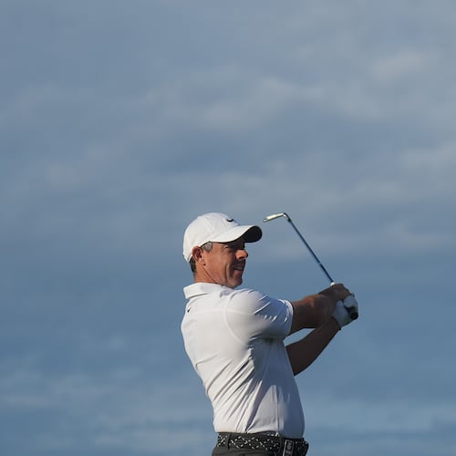 Rory McIlroy of Northern Ireland plays an approach shot on the 10th hole during the first round of the Australian Open golf tournament in Melbourne, Australia, Thursday, Dec. 4, 2025. (AP Photo/Asanka Brendon Ratnayake)
