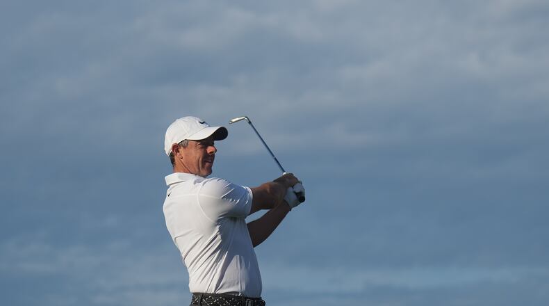 Rory McIlroy of Northern Ireland plays an approach shot on the 10th hole during the first round of the Australian Open golf tournament in Melbourne, Australia, Thursday, Dec. 4, 2025. (AP Photo/Asanka Brendon Ratnayake)
