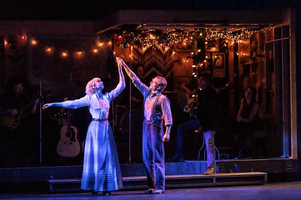 This image released by DKC/O+M shows Andrew Durand, right, and Julia Knitel during a performance of “Dead Outlaw." (Matthew Murphy/DKC/O+M via AP)