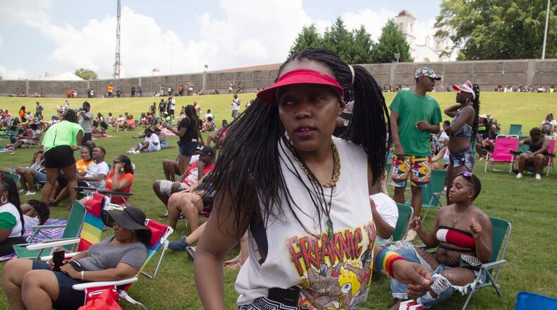 Jgenisius Harris dances to the music in her 1995  Freaknik shirt during the FreakNik 2019 concert at the Cellairis Amphitheatre at Lakewood Saturday, June 22, 2019. Harris said her family went to the 1995 Freaknik and she got the tee shirt.  STEVE SCHAEFER / SPECIAL TO THE AJC