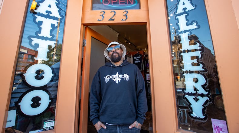 Miya Bailey is at City of Ink on Walker Street on Wednesday, Feb 21, 2024.  Bailey, who also owns Peters Street Station, a community center and coffee shop with a back room art gallery, is the entrepreneur, tattoo artist and property owner who continues to be a creative inspiration for the community.   (Jenni Girtman for The Atlanta Journal-Constitution)