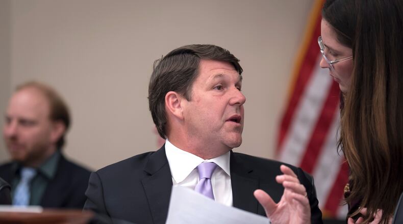 House Budget Committee Chairman Jodey Arrington, R-Texas, center, speaks with an aide during a markup on the Fiscal Year 2027 spending plan, at the Capitol in Washington, Thursday, July 16, 2026. (AP Photo/J. Scott Applewhite)