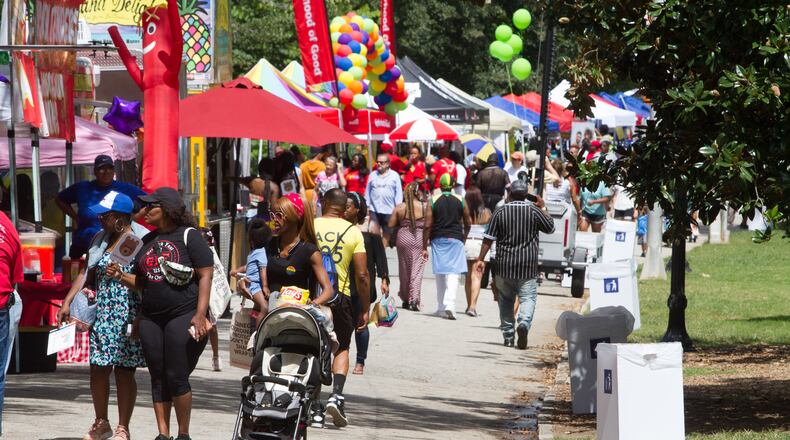 People walk past the vendor booths during the Pure Heat Community Festival celebrating Atlanta Black Pride Weekend in Piedmont Park Sunday, September 2, 2018. STEVE SCHAEFER / SPECIAL TO THE AJC