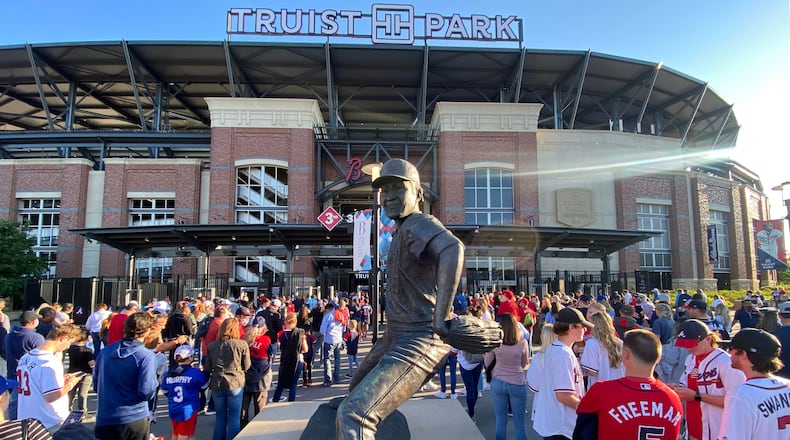 Fans line up to get into Truist Park before the Braves' game against the Philadelphia Phillies on May 7, 2021. (Hyosub Shin / Hyosub.Shin@ajc.com)
