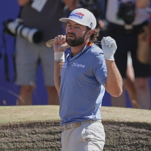 Cameron Young of the United States reacts after playing out of a bunker on the 18th green during the final day of the British Open Golf championships at Royal Birkdale golf club, in Southport, England, Sunday, July 19, 2026. (AP Photo/Peter Morrison)