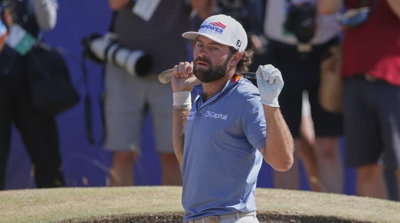Cameron Young of the United States reacts after playing out of a bunker on the 18th green during the final day of the British Open Golf championships at Royal Birkdale golf club, in Southport, England, Sunday, July 19, 2026. (AP Photo/Peter Morrison)