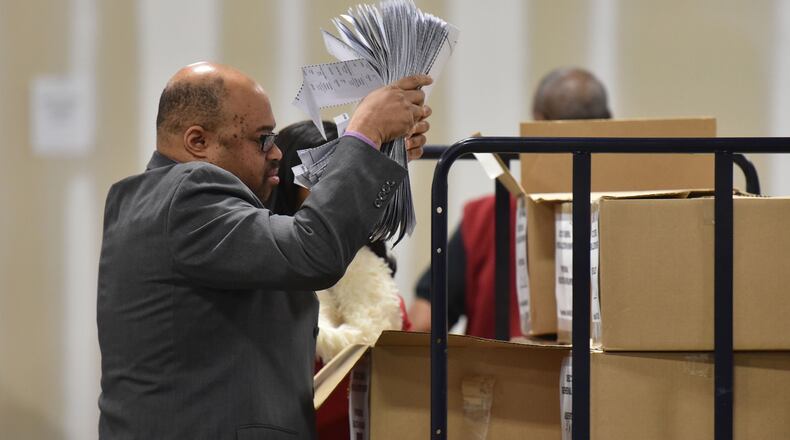 Ralph Jones, registration manager prepares to recount the votes cast in the Atlanta mayoral election runoff at the Fulton County Elections Preparation Center. HYOSUB SHIN / HSHIN@AJC.COM AJC FILE PHOTO