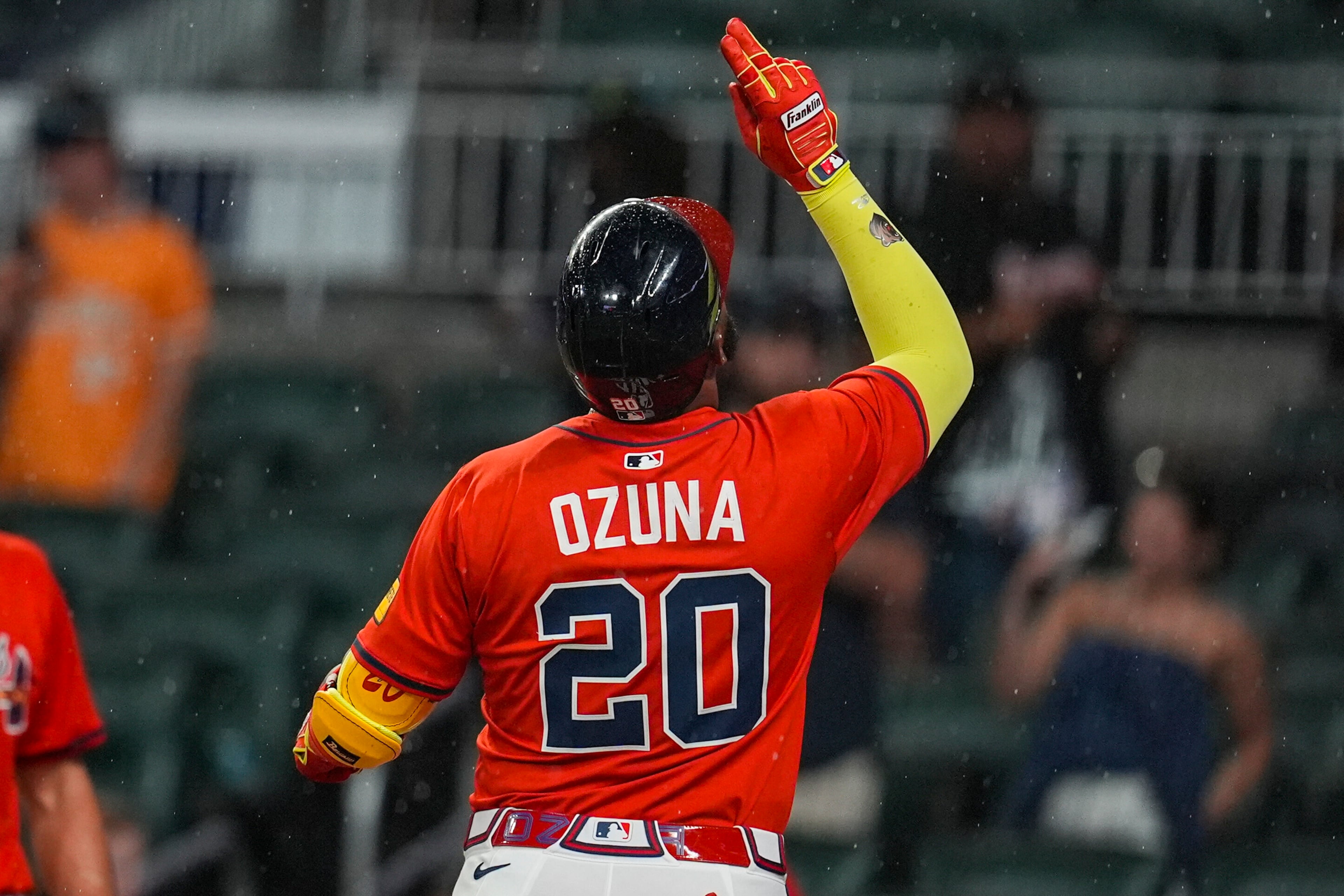 Atlanta Braves designated hitter Marcell Ozuna celebrates his three-run home run against the Colorado Rockies in the seventh inning of Friday's baseball game at Truist Park in Atlanta. (Mike Stewart/AP)