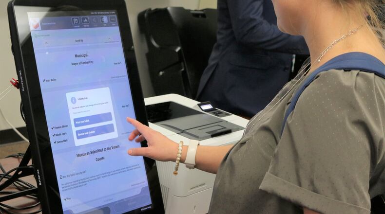 Georgia’s new voting machines by Dominion Voting Systems were demonstrated at the Secretary of State’s Office on Tuesday, Aug. 6, 2019. Voters will make their choices on touchscreens, which are connected to computers that will print out paper ballots for tabulation. Photo credit: Georgia Secretary of State