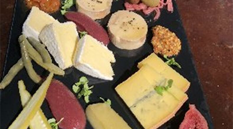 Apple puree can be seen on a cheese plate at Century House Tavern.