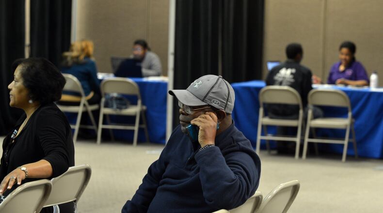 Oliver Williams waits his turn for help signing up for health insurance during an enrollment event at World Changers Church International Monday, March 31, 2014. Williams said he had considered paying the penalty. "I know I need it. I haven't had health insurance in 10 years. I know I'll feel better once I sign up," Williams said.