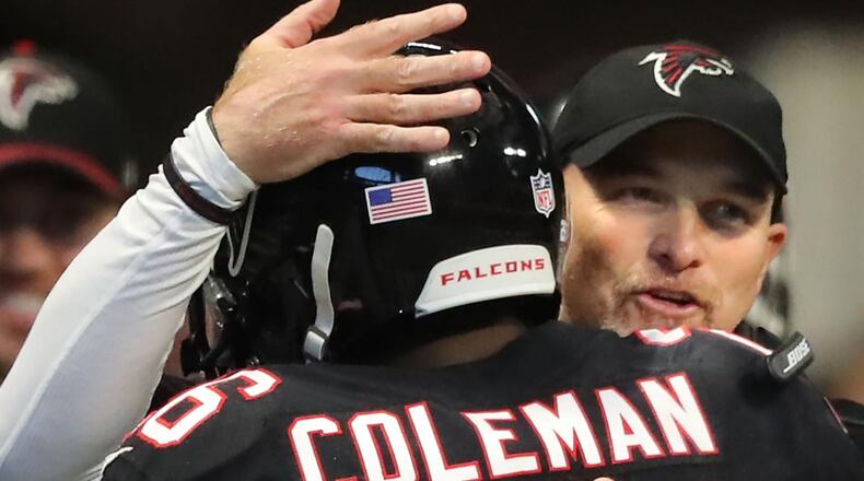 Falcons head coach Dan Quinn gives running back Tevin Coleman a hug after his first of two touchdown runs against the Buccaneers during the second half on the way to a 34-20 victory in a NFL football game on Sunday, November 26, 2017, in Atlanta. Curtis Compton/ccompton@ajc.com