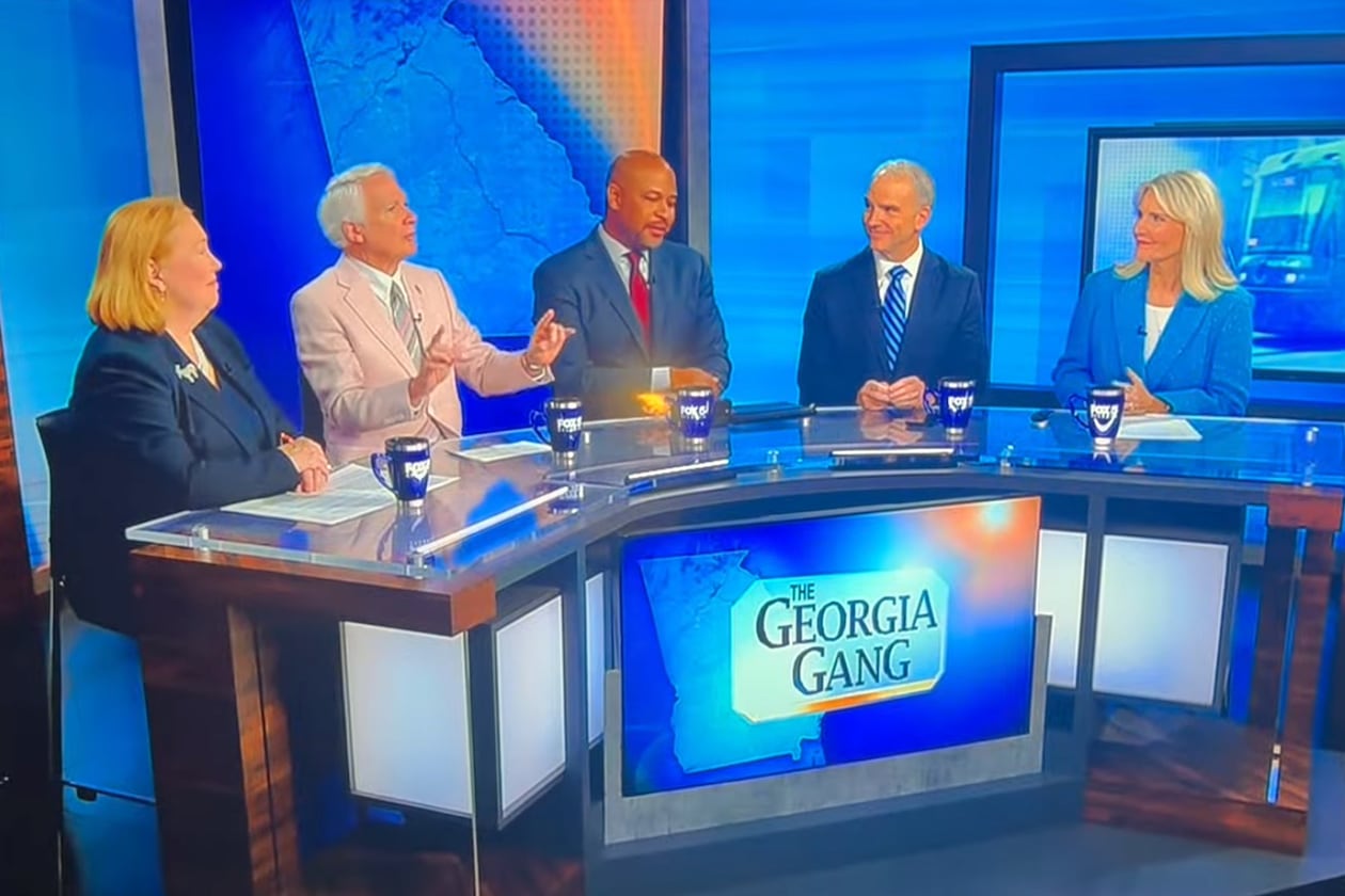 This screenshot shows the episode of Fox 5's “The Georgia Gang” that aired on Sunday, Aug. 23, 2026, after panelist Phil Kent (second from left) said free speech had limits and that a person shouldn't wear a T-shirt condoning violence like “Kill Tharon Johnson.” Johnson (center) reacted to that comment with a grimace, saying “Don't say that, Phil.” (Courtesy of Fox 5)