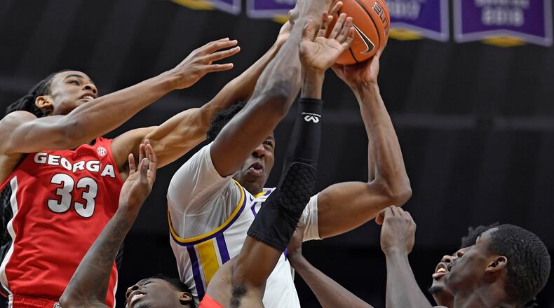LSU forward Kavell Bigby-Williams battles for a rebound along with Georgia's Nicolas Claxton (33), Teshaun Hightower (1) and Jordan Harris (2) Wednesday, Jan. 23, 2019, in Baton Rouge, La.