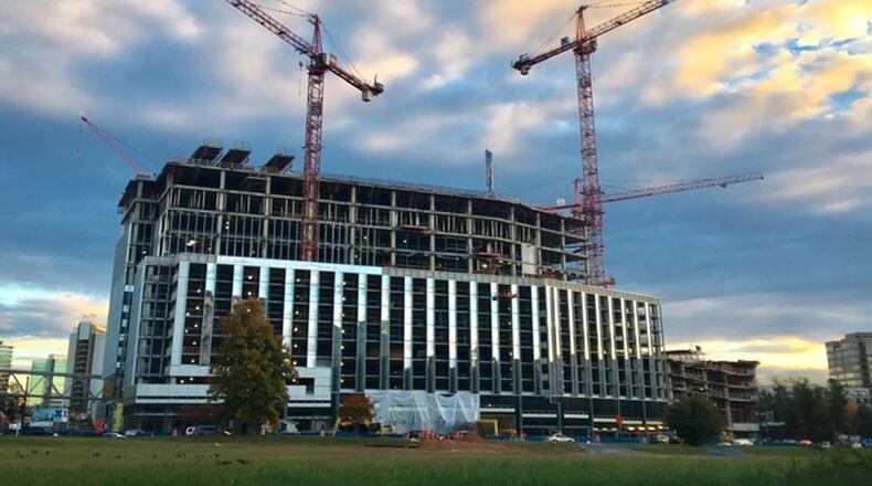 Workers are building the second tower of the State Farm complex in Dunwoody. (Todd C. Duncan / AJC staff photo)