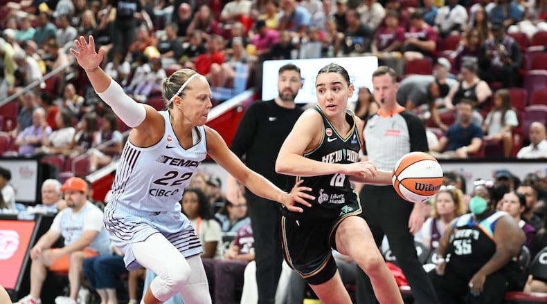 Toronto Tempo's Julie Allemand (22) defends against New York Liberty's Pauline Astier (18) during the second half of a WNBA basketball game in Montreal, on Sunday, July 12, 2026. (Graham Hughes/The Canadian Press via AP)
