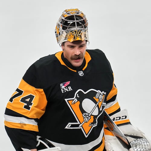 FILE - Pittsburgh Penguins goaltender Stuart Skinner takes a timeout during the first period of an NHL hockey game against the Dallas Stars in Pittsburgh, March 28, 2026. (AP Photo/Gene J. Puskar, File)