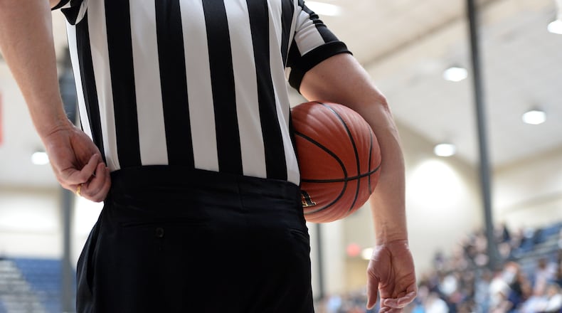 MARCH 4, 2017  MARIETTA A referee is shown during a timeout as the St Francis Knights play the Greenforest Eagles in the state semi-finals of the high school basketball playoffs at the Cobb County Civic Center Saturday, March 4, 2017. 
The winner will advance to the state championships next week at either Georgia Tech or UGA. Kent D. Johnson/AJC