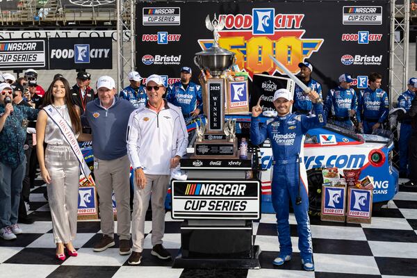 From right, Kyle Larson, celebrates with President of Food City, Steve Smith, Bristol Motor Speedway President Jerry Caldwell, and Miss Food City Taylor Parsons after winning a NASCAR Cup Series auto race, Sunday, April 13, 2025, in Bristol, Tenn. (AP Photo/Wade Payne)