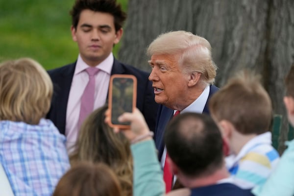 President Donald Trump greets people during the White House Easter Egg Roll on the South Lawn of the White House, Monday, April 21, 2025, in Washington. (AP Photo/Alex Brandon)