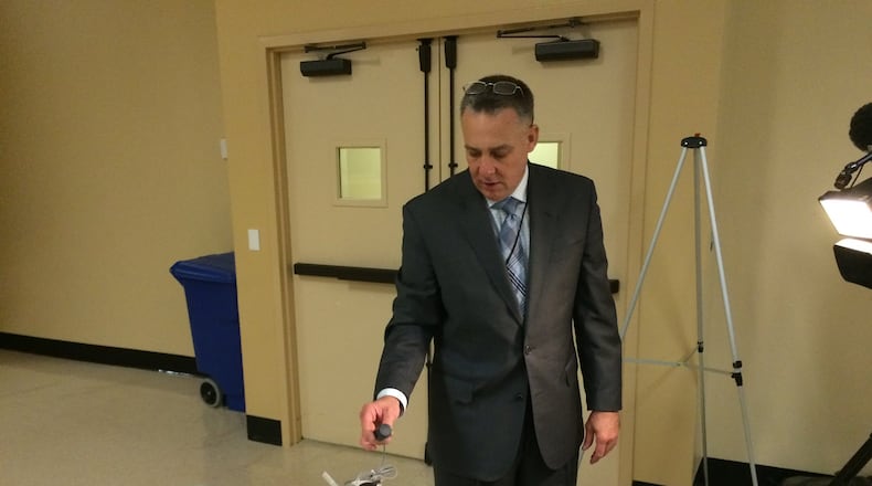 DeKalb Director of Watershed Management Scott Towler shows the county’s new smart water meters on Dec. 1. These meters will be installed across the county and transmit water usage information as part of an effort to improve water billing accuracy. (MARK NIESSE / MARK.NIESSE@AJC.COM)