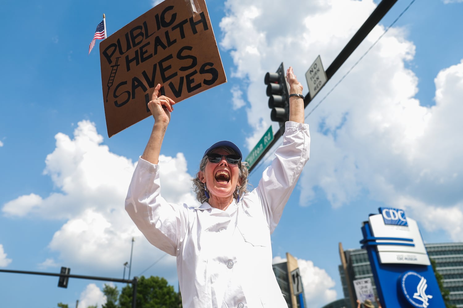Lynn Beach shouts in protest outside of the CDC in Atlanta on Wednesday, June 25, 2025. Beach said her husband worked for the CDC for 33 years. As Health and Human Services Secretary Robert F. Kennedy Jr. purged and reconstituted CDC vaccine advisory panel, ACIP, convenes for the first time, CDC advocates gather to protest on the dangers to health. (Abbey Cutrer / AJC)