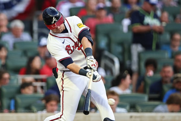 Atlanta Braves' Austin Riley hits a single in the fourth inning of a baseball game against the Los Angeles Angels, Tuesday, July 1, 2025, in Atlanta. (AP Photo/Colin Hubbard)