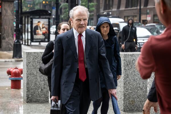 Flanked by attorneys and supporters, Illinois' former House Speaker Michael Madigan walks into the Dirksen Federal Courthouse for his sentencing hearing, Friday, June 13, 2025, in Chicago. (Ashlee Rezin/Chicago Sun-Times via AP)
